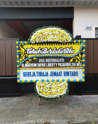 Papan Bunga Duka di Purba